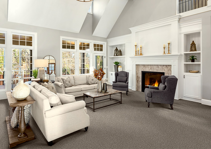 gray carpet in living room with fireplace